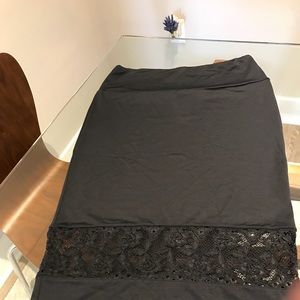 bebe Black skirt with lace bottom trim